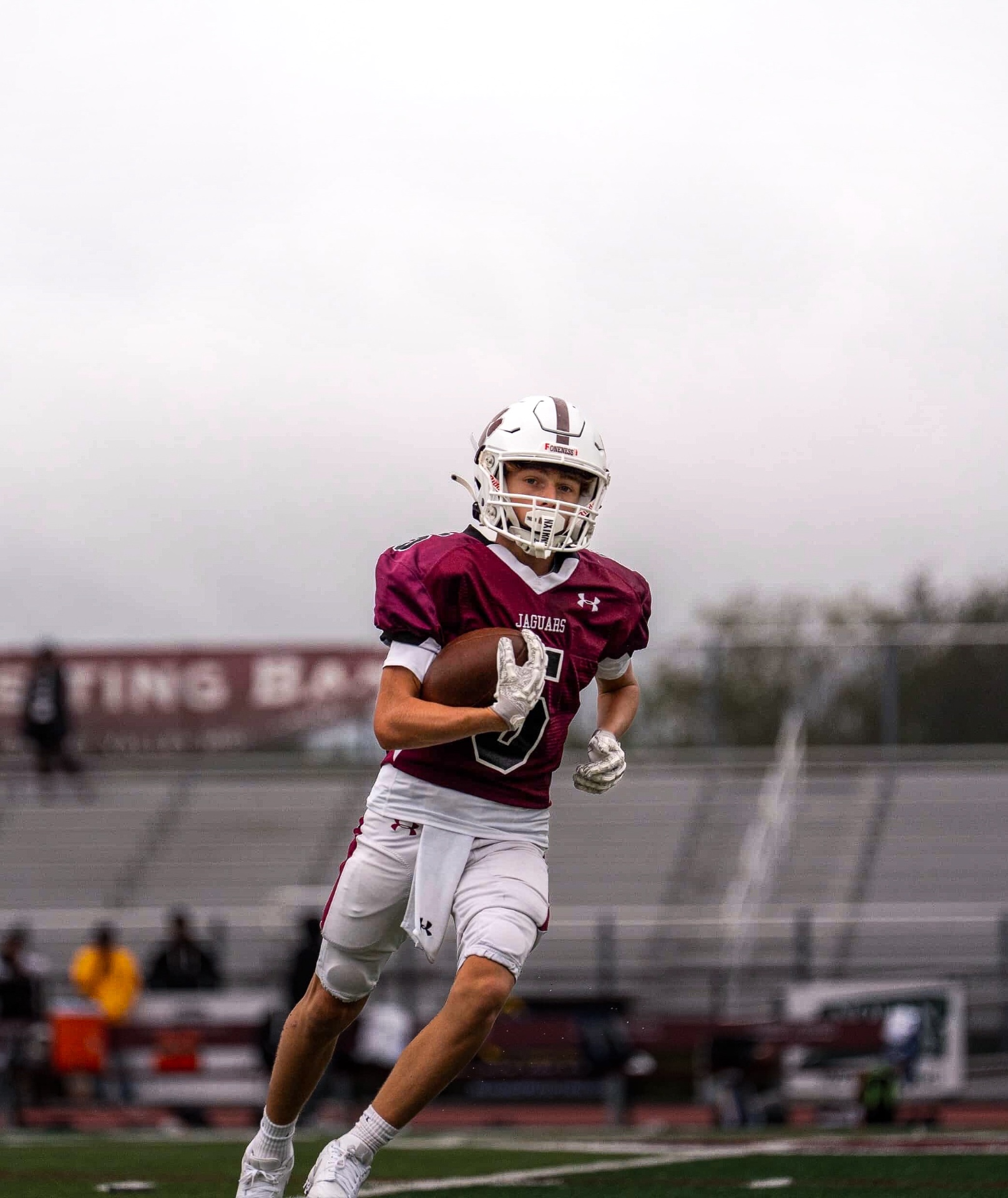 Michael Wolski sprinting under stadium lights
